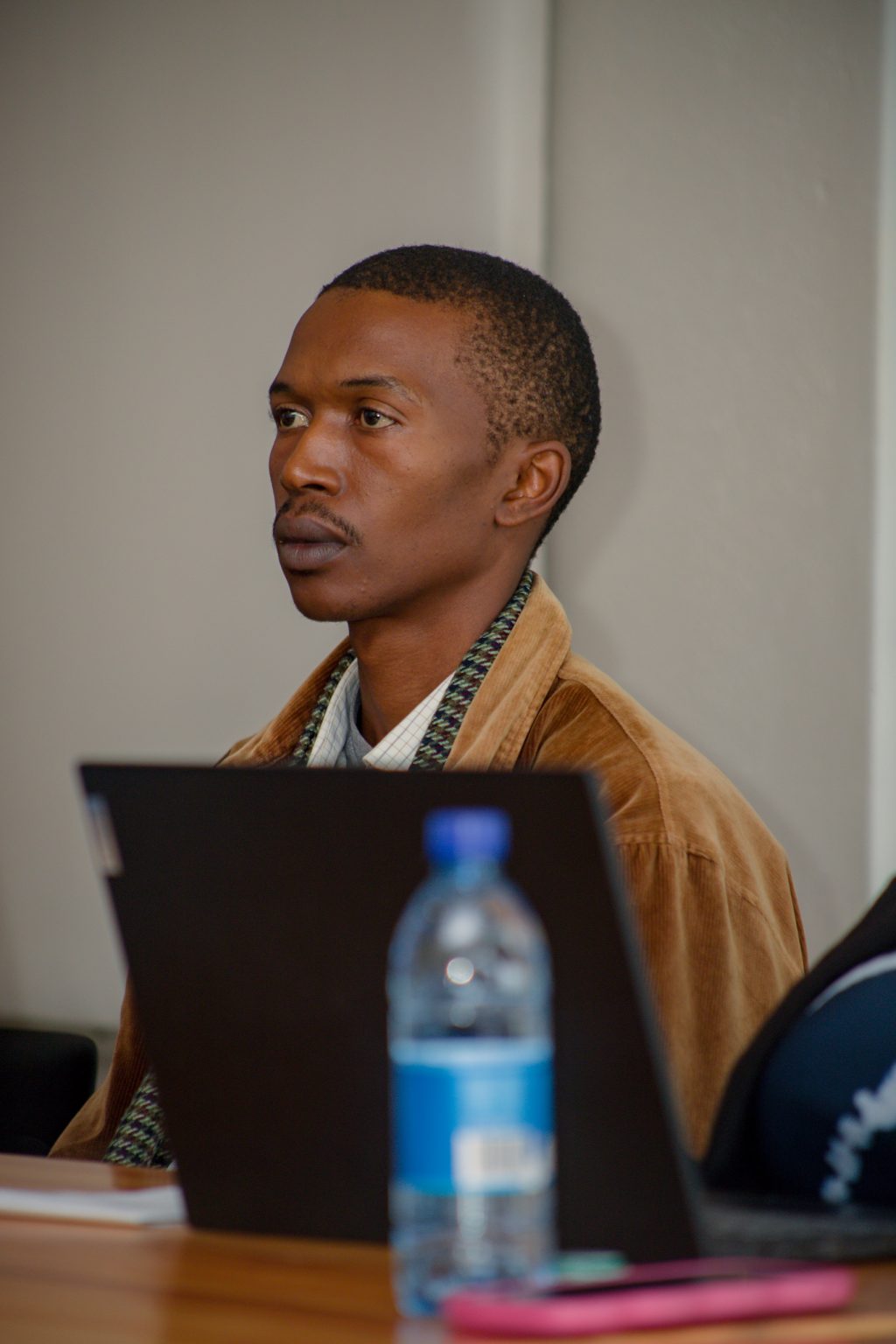 A participant following the discussion at a Stratcom session