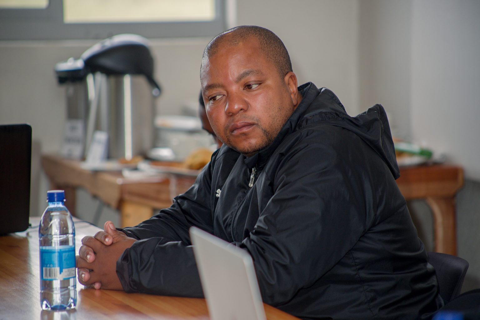 A participant listening during a Stratcom session