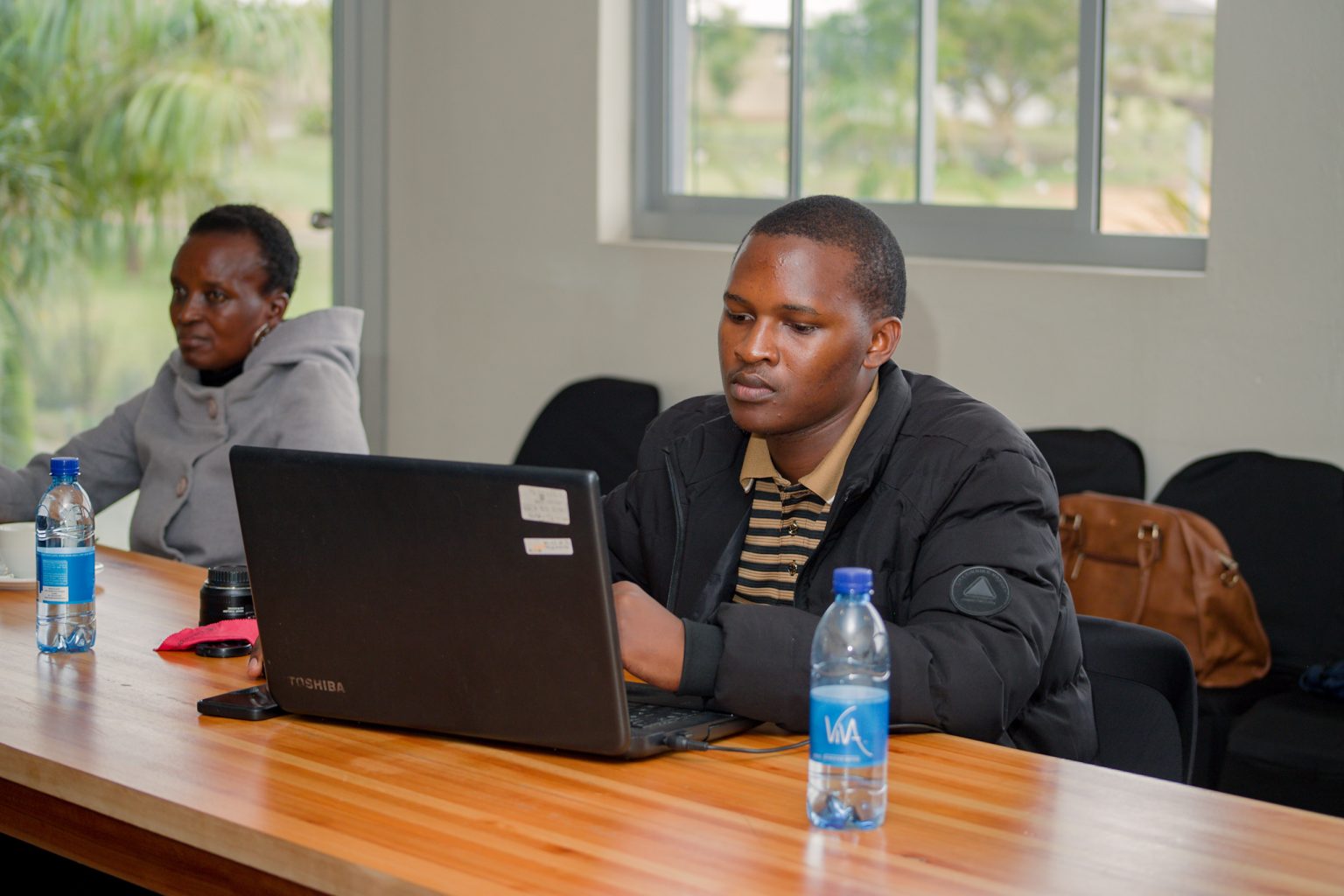 Working on a laptop during a Stratcom session